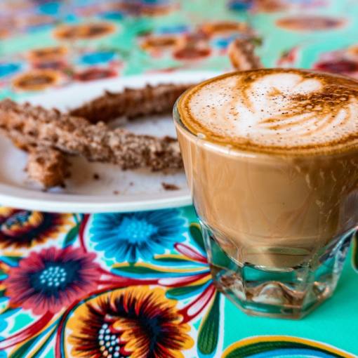 Coffee and fresh churros at Cocoa Cinnamon Lakewood in Durham, NC