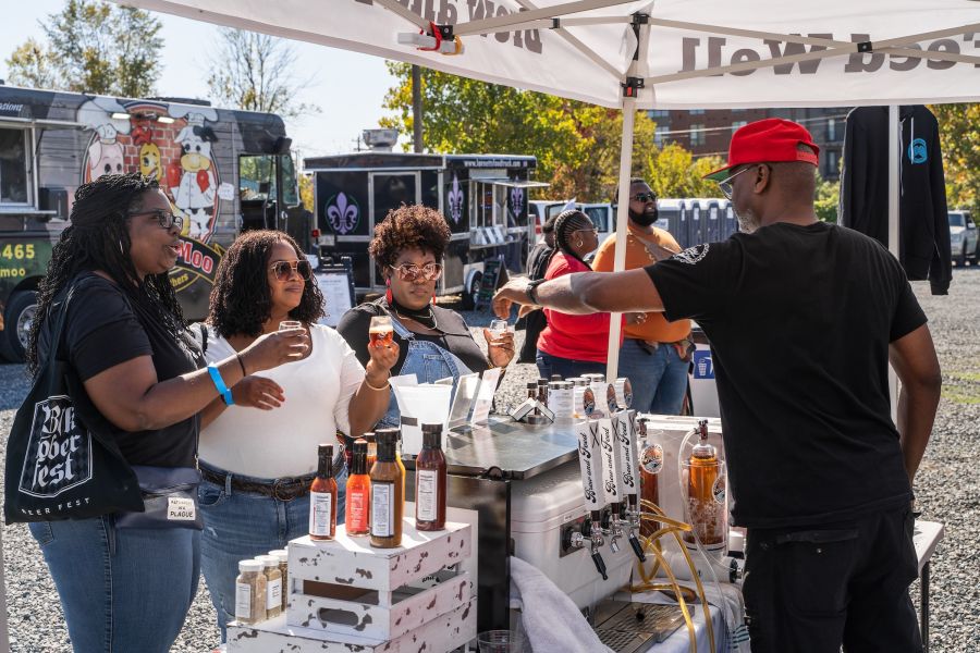 Guests line up for free samples at Blacktoberfest in Durham, NC.