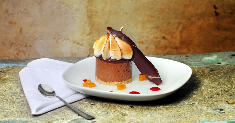 A chocolate dessert is artistically plated at Guglhupf in Durham, NC.