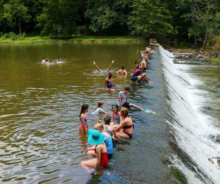 People swimming in the Eno River at Westpoint on the Eno. Durham, NC