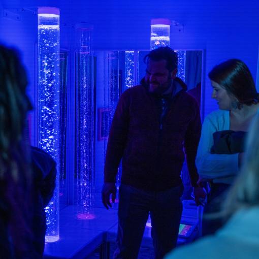 Visitors walk through the Multi Sensory Environment at the Durham County Main Library.