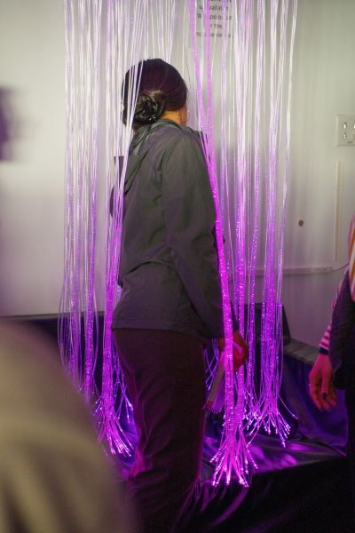 A visitor engages with the multi-sensory environment at the Durham County Main Library.