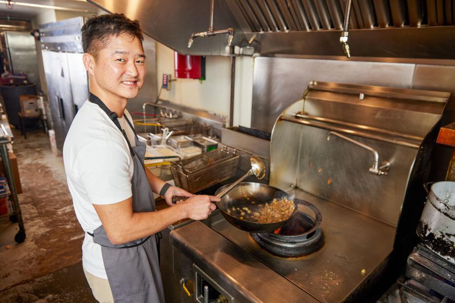 Chef Mike Lee cooks food on the stove at M Kokko