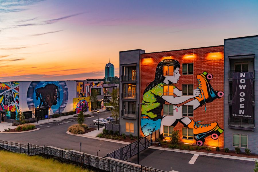 A sunburst sky stands above the murals at U Hill Walls.