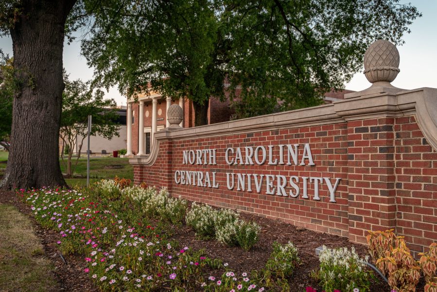 Plants surround the main sign on North Carolina Central University's campus.