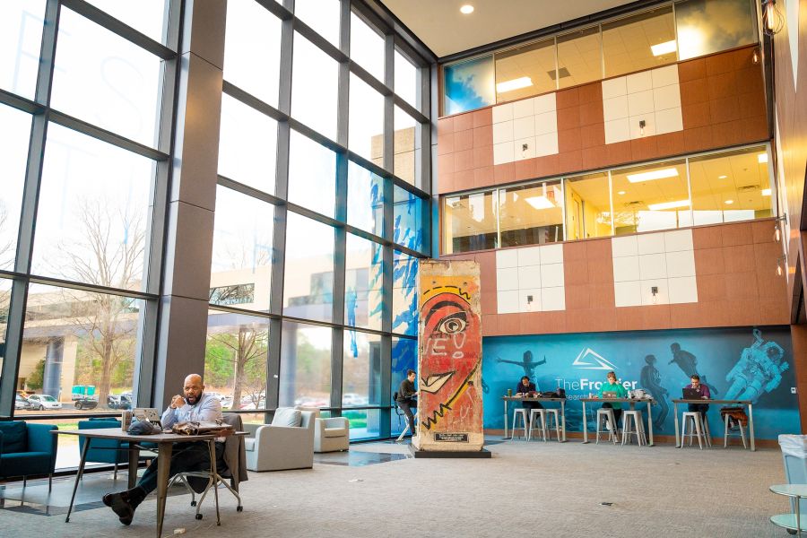 People work in abundant natural lighting in the large space at Frontier RTP