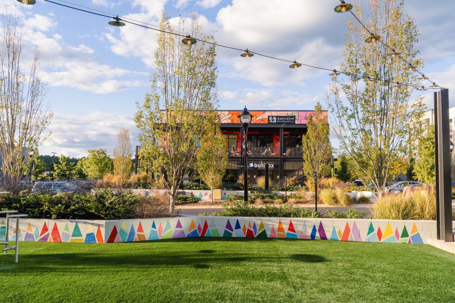 A view of Bowerbird Flowers and Apothecary, Apéritif, and Bul Box in UHills.