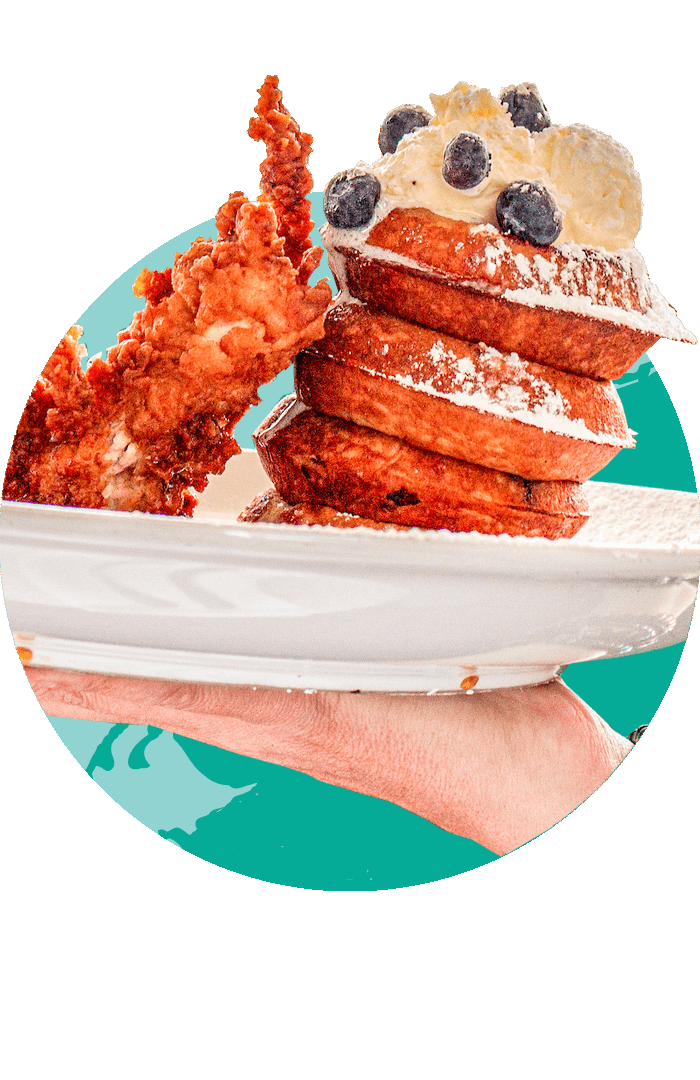 True Flavors chicken and waffles piled high on a platter